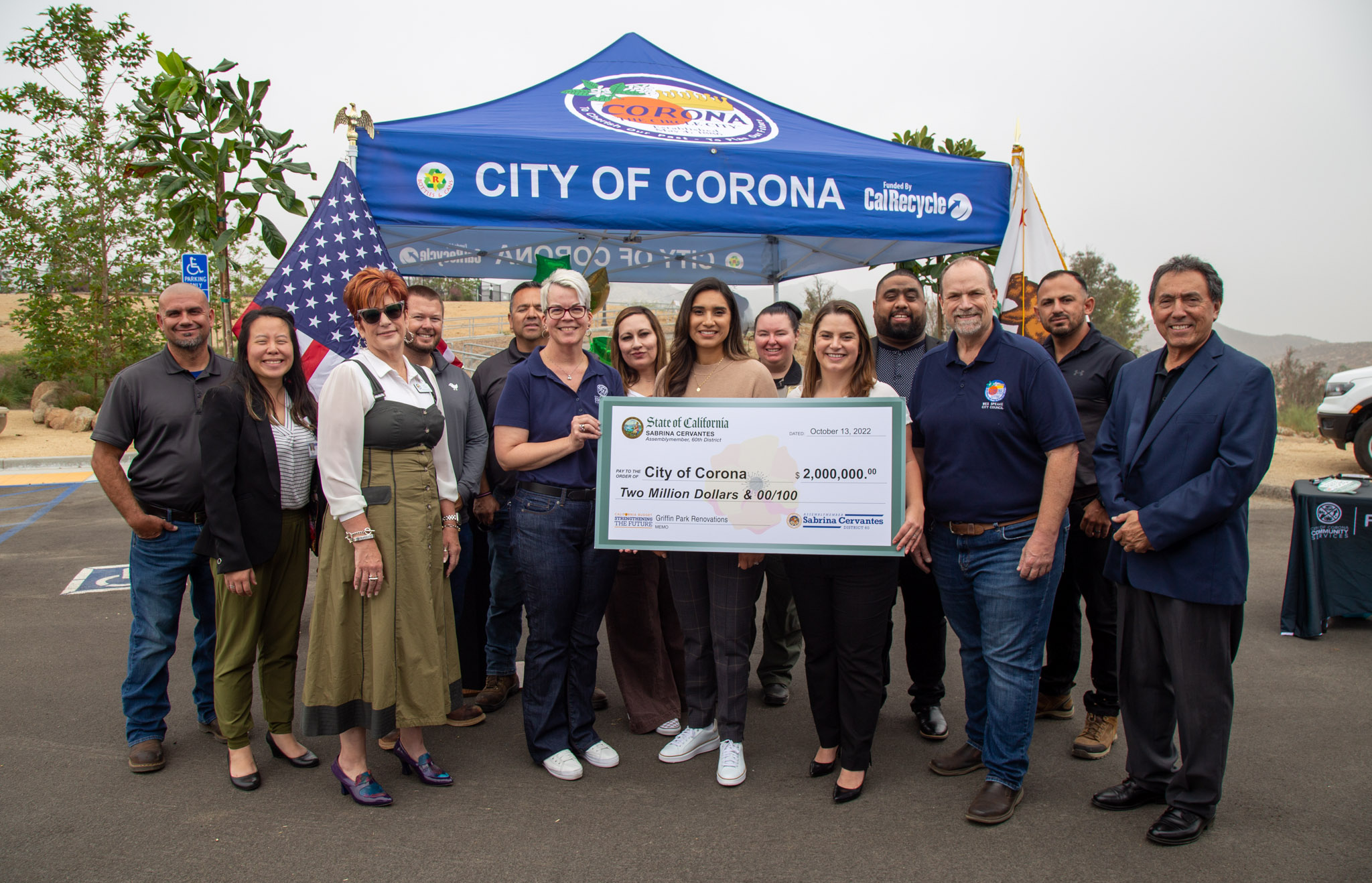 Assemblymember Sabrina Cervantes and City of Corona representatives holding a large oversized check of $2 million for Griffin Park